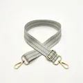 Close-up of adjustable fabric shoulder strap with grey and white geometric patterns and gold clips - No. 8 Light Green