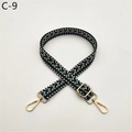 Macro detail of dark green and white herringbone webbing strap with gold swivel hooks - Green (C-9)