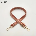 Detail of adjustable wide woven shoulder strap with geometric patterns and gold metal clasps - Orange (C-10)