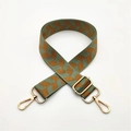 Detail of adjustable woven bag strap with green herringbone pattern and gold metal hooks - Matcha Green