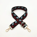Detail of adjustable woven canvas bag strap with colorful geometric diamond leaf patterns - Brown