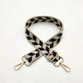 Close-up of adjustable strap with black arrow jacquard pattern and gold metal buckles - Khaki Blue Leaves