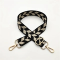 Detail of adjustable woven shoulder strap with black and white V-shape geometric pattern - Black Beige Leaves
