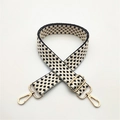 Detail of adjustable black and white geometric woven strap with gold metal hooks - Black