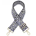 Detail view of the leopard print bag strap with adjustable gold metal buckle hardware - Silver Clasp / Black Blue Spotted Leopard