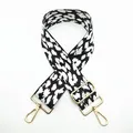 Detail of adjustable leopard print bag strap with golden lobster clasps and buckles - White Leopard Spot (No. 10)
