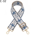 Detail of embroidered beige bag strap with blue floral patterns and gold metal clasps - Blue & White Pattern (C-32)