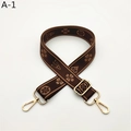 Detail of adjustable woven replacement strap with geometric floral patterns and gold clips - A-1 Coffee