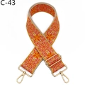 Close-up of bohemian orange floral woven bag strap with polished gold metal swivel hooks - C-43 Orange