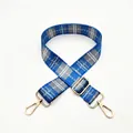 Close-up of blue and grey plaid adjustable replacement strap with gold metal carabiner clips - No.8 Blue Gray Plaid