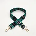 Detail view of adjustable green and black plaid strap with gold metal lobster clasps - No.11 Green Black Plaid