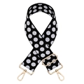Close-up of black and white polka dot jacquard woven bag strap with gold metal hooks - Silver Clasp / Black