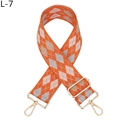 Detail of colorful jacquard diamond pattern bag strap with gold metal lobster clasps - Orange