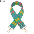 Close-up of adjustable jacquard bag strap with geometric diamond pattern and gold hardware - Green