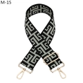 Macro view of adjustable woven shoulder strap with black and grey maze pattern and gold buckles - M-15 Light Green