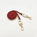 Detail of red and white woven rope strap with gold thread and metallic lobster clasp - 80cm Length / Burgundy
