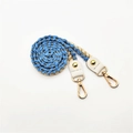 Detailed close-up of woven blue and beige rope strap with golden lobster clasp and white leather - Lake Blue
