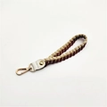 Close-up of woven cotton rope strap with gold accents and metallic lobster clasp - Silver Clasp / Burgundy