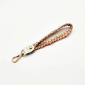 Detail of pink and cream braided cotton wrist strap with gold metallic threads and lobster clasp - Silver Clasp / Pink