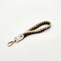 Detail of two-tone braided hand strap with gold-tone lobster clasp for handbags - Silver Clasp / Coffee