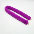Detail of purple faux fur bag strap with gold metal lobster clasps on white background - Purple