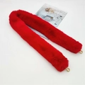 Macro view of soft red faux fur bag strap with gold metal lobster clasps for winter bags - Red