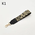 Detail of leopard print handbag strap with gold spring clasps and leather ends - Silver Clasp / Khaki Leopard
