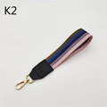 Colorful striped fabric wrist strap with leather trim and gold metal clasp for handbags - Pink Purple Stripes
