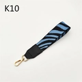 Detailed blue zebra pattern strap with black leather accents and a gold lobster clasp - Lake Blue Zebra