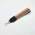 Detail of colorful woven handbag wrist strap with black leather and gold metal clasp - No.1 Light Weave + Black Leather / Silver Clasp