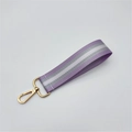 Macro shot of purple and grey striped woven nylon strap with a gold lobster clasp - Light Purple