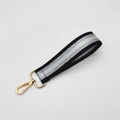 Short striped handbag strap in black and silver with polished gold lobster clasps - Black