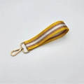 Close-up of yellow striped webbing strap with gold lobster clasp and glitter details - Silver Clasp / Yellow