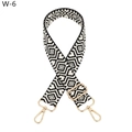Close-up of black and white geometric jacquard strap with golden rotating metal hooks - Black Strap Gold Buckle