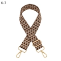 Macro detail of geometric woven bag strap with gold metal hooks and adjustable slider - Gold Thread Brown