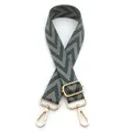 Detail of adjustable woven shoulder strap with green chevron pattern and gold metal hooks - Green