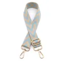 Detail view of adjustable woven bag strap with blue chevron pattern and gold metal hooks - No.19 Beige & Light Blue