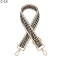 Close-up of thick woven canvas shoulder strap with green chevron pattern and gold metal hardware - Khaki Border Green