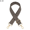 Detail of adjustable bag strap with gold lobster claw clasps and U-shaped geometric pattern - K-19
