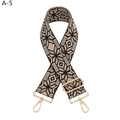 Detailed view of the ethnic geometric star pattern on the black and beige woven strap - Black Geometric (A-5)