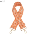 Close-up of ethnic geometric pattern strap with adjustable golden metal buckle and clasp - Orange Geometric (A-12)