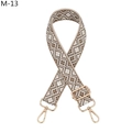Close-up of geometric jacquard bag strap with gold-tone swivel hooks and adjustable buckle - Gold Buckle / M-13 Khaki Coffee Rhombus