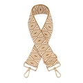 Macro shot of ethnic geometric pattern woven strap with gold metal buckle and hook - Brown