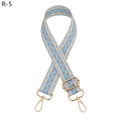 Detail view of adjustable wide bag strap with blue wave pattern and gold metal hooks - Light Blue