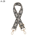 Close-up of ethnic jacquard strap with geometric patterns and light gold metal buckles - A-28 Black Beige Floral