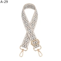 Close-up of wide bohemian grey and white geometric woven strap with golden metal hardware - A-29 Beige Edge Gray Floral