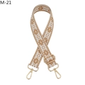 Close-up of bohemian woven shoulder strap with geometric patterns and gold metal clasps - Brown (M-21)