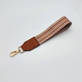 Short geometric woven handbag strap with brown leather ends and golden lobster clasp - Brown