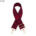 Detail of red and black geometric jacquard bag strap with gold metal hooks and buckle - Silver Clasp / Red and Black Geometric Wave (X-25)