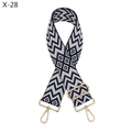 Close-up of jacquard geometric pattern strap with adjustable gold-tone metal hardware - Silver Clasp / Dark Blue and White Geometric (X-28)